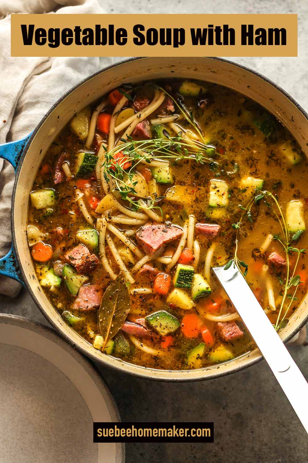 A large pot of vegetable soup with ham.