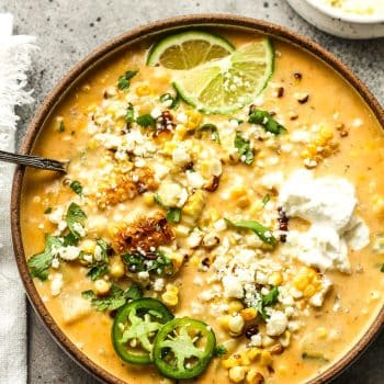 Closeup on a bowl of Mexican Street Corn chowder with cotija cheese.