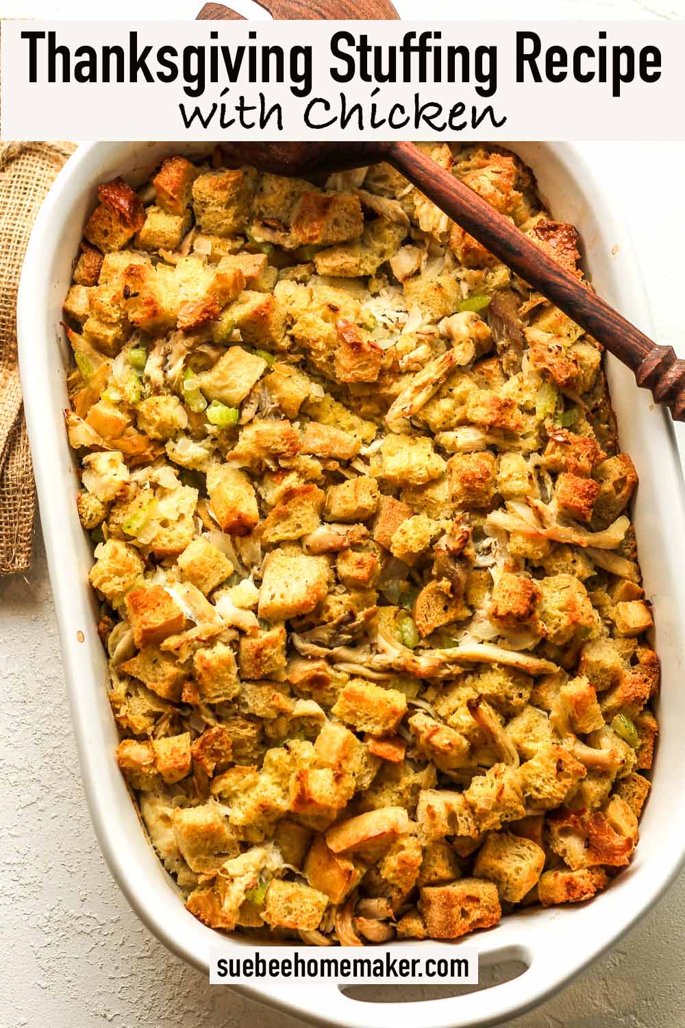 A large casserole dish of Thanksgiving stuffing recipe with chicken.