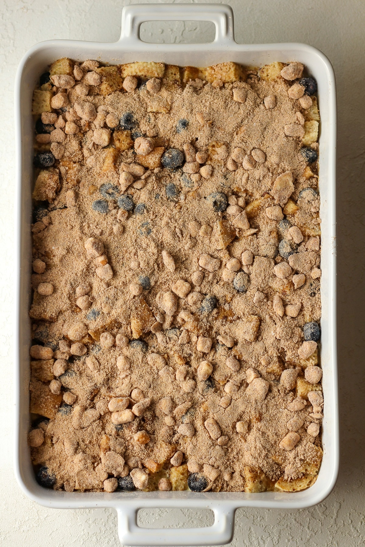 A large casserole of blueberry French toast before baking.