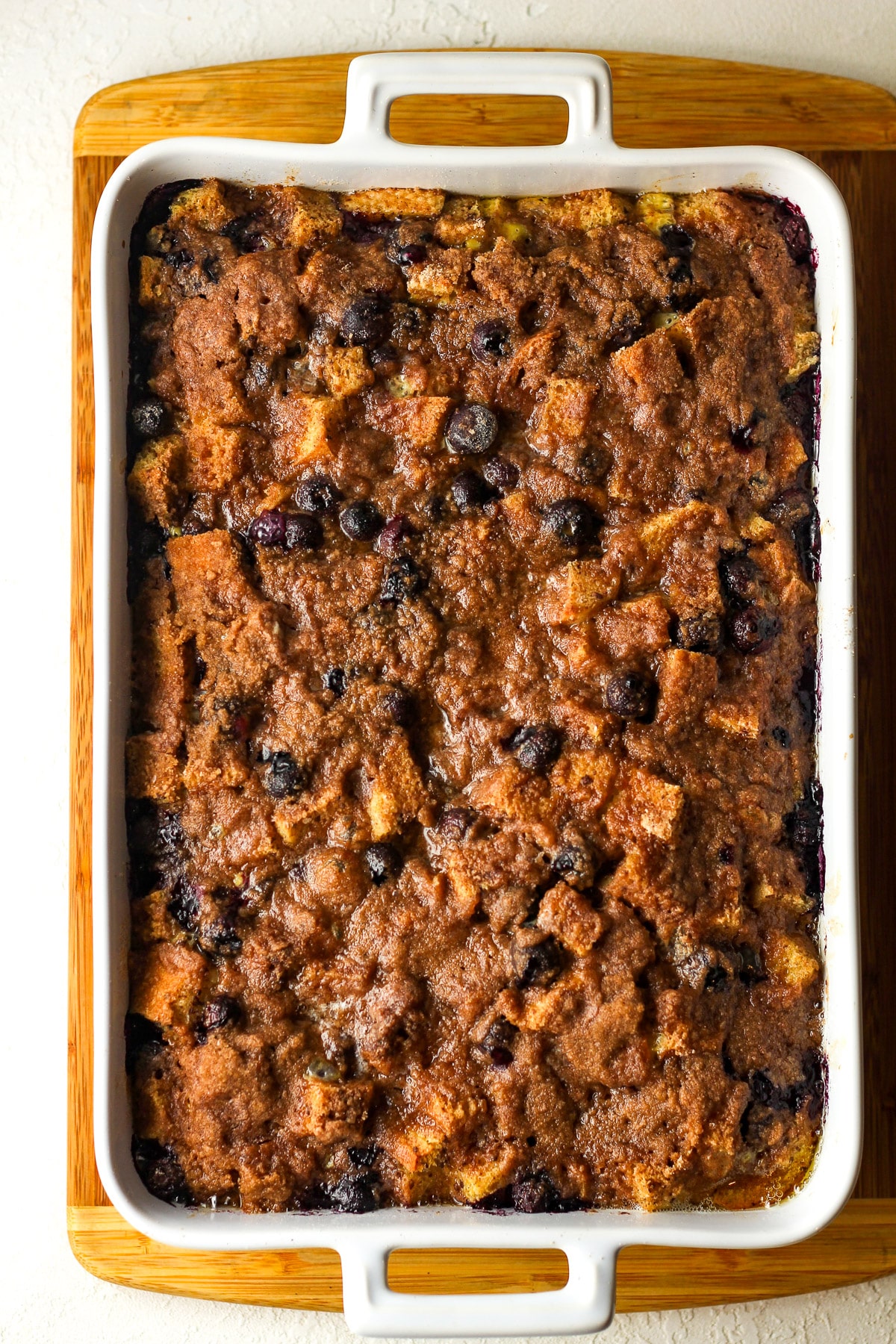 Overhead view of a large casserole with blueberry French toast.