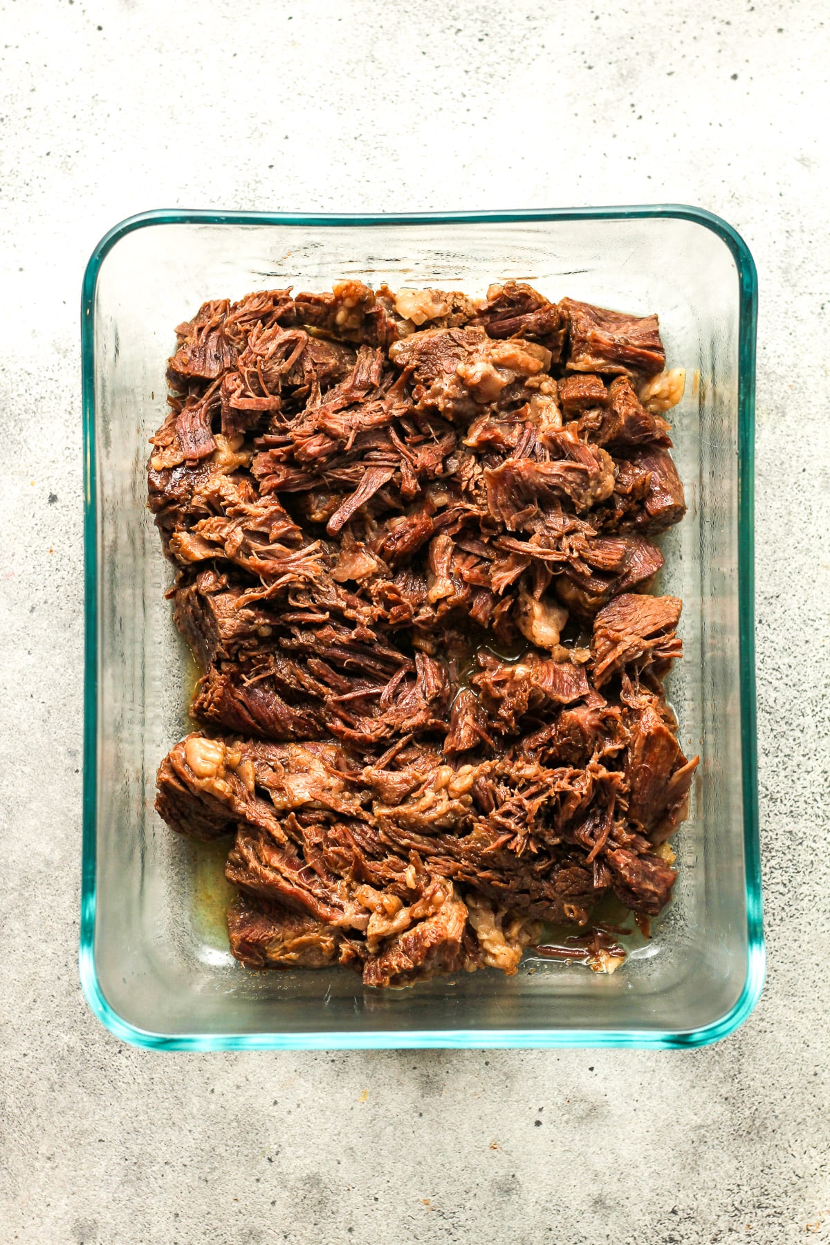 A dish of the cooked and shredded roast beef.