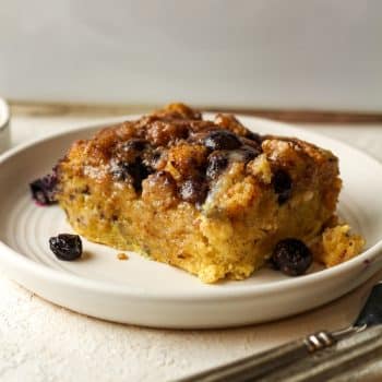 Side view of a square of blueberry French toast casserole.