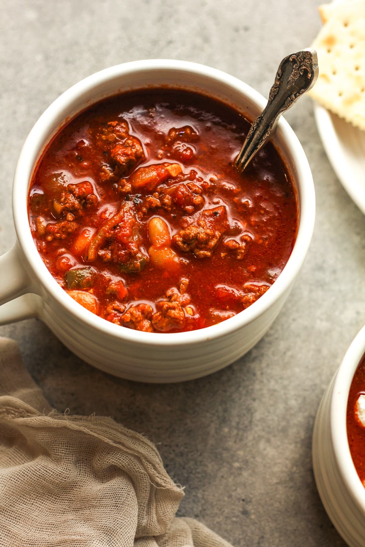 Overhead view of a large mug of crock pot chili.