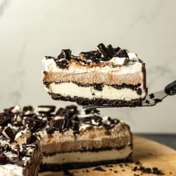 A spatula lifting up a slice of Oreo ice cream pie.