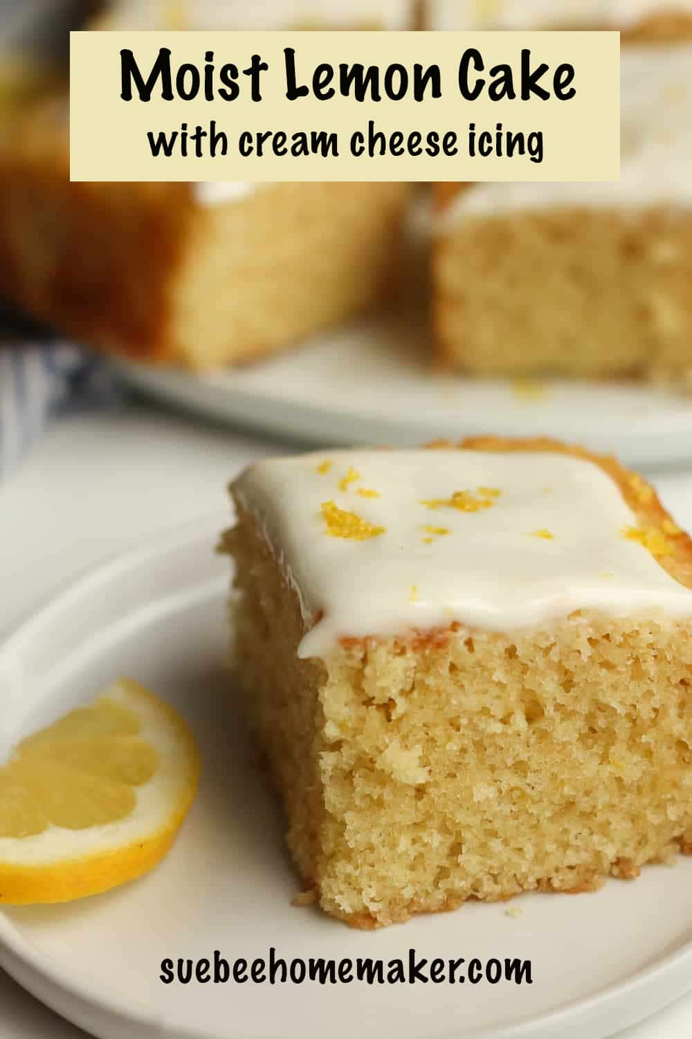 Side view of a slice of moist lemon cake with cream cheese icing, topped with lemon zest.