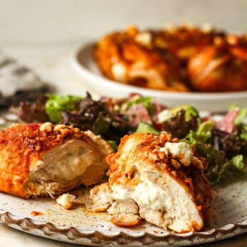 Side view of a stuffed buffalo chicken breast showing the insides.