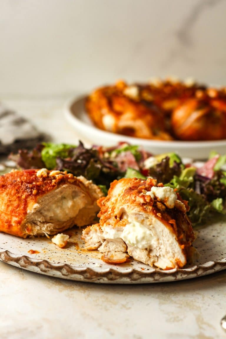 Side view of a stuffed buffalo chicken breast showing the insides.