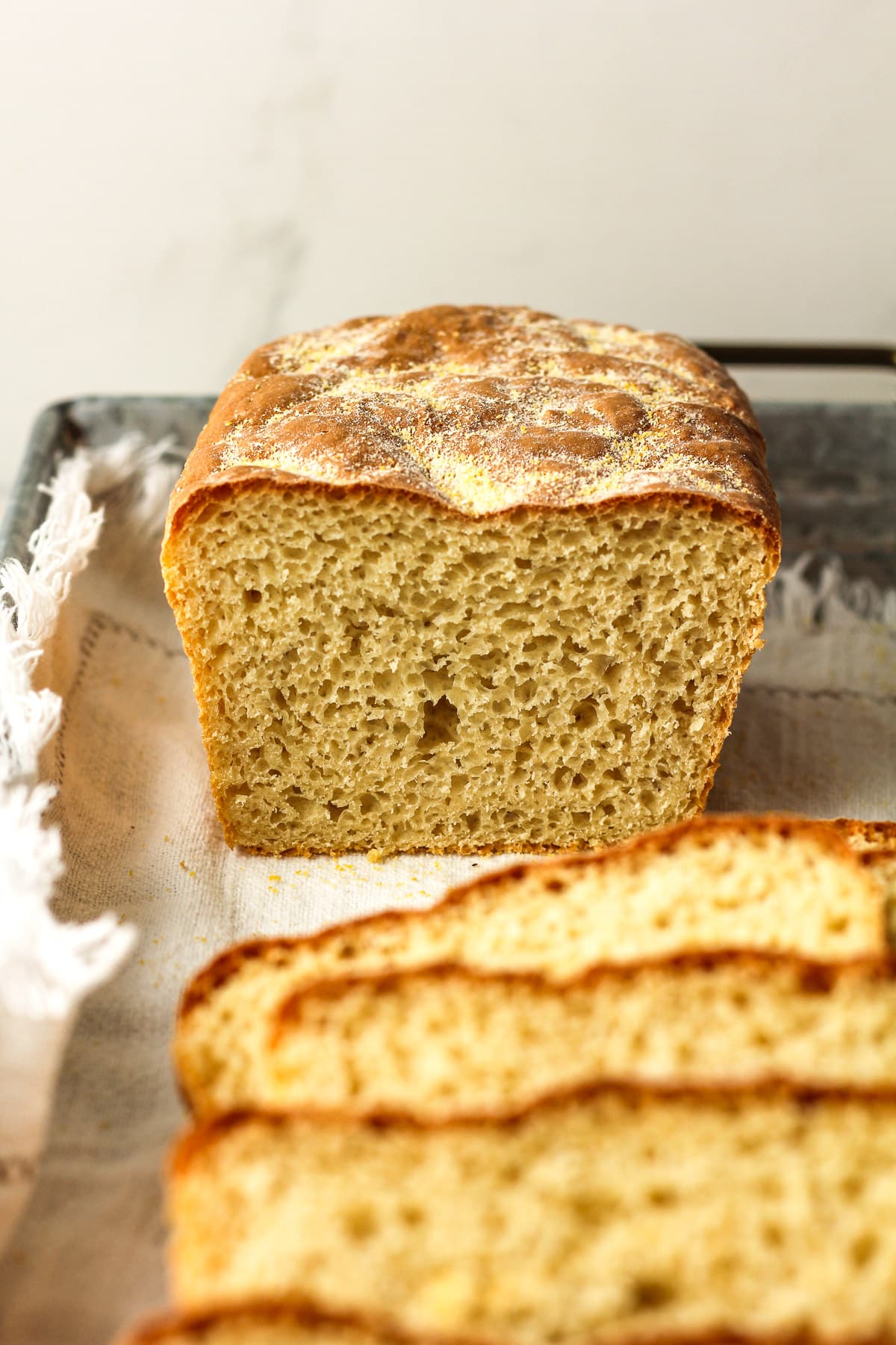 Side view of a half loaf of English muffin bread.