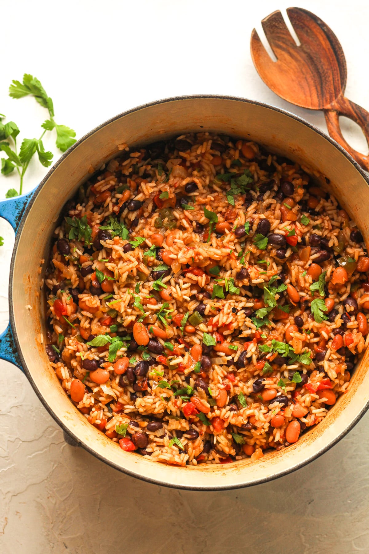 A Dutch oven of Mexican rice and beans.