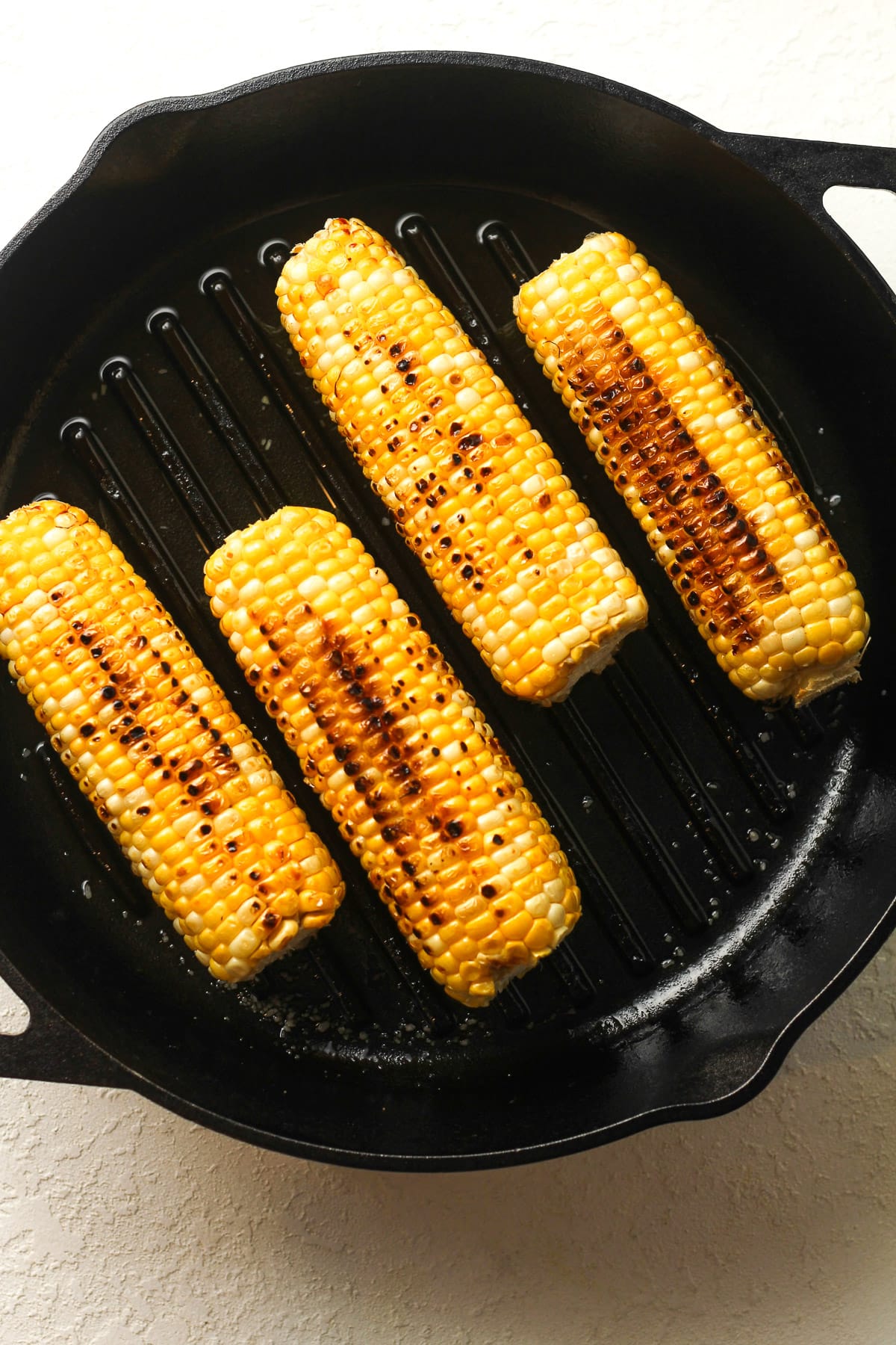 A skillet of the sautéed ears of corn.