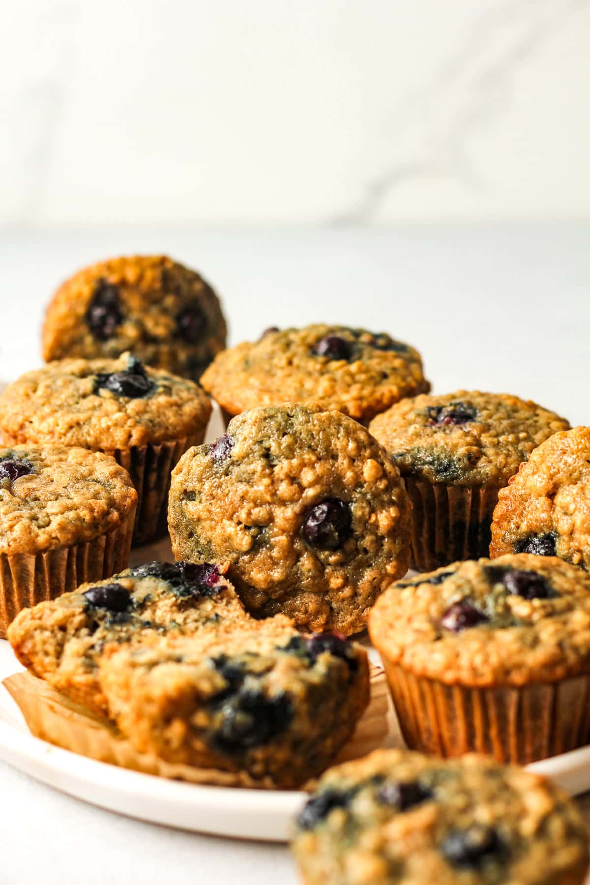 Side view of a plate of the oatmeal muffins.