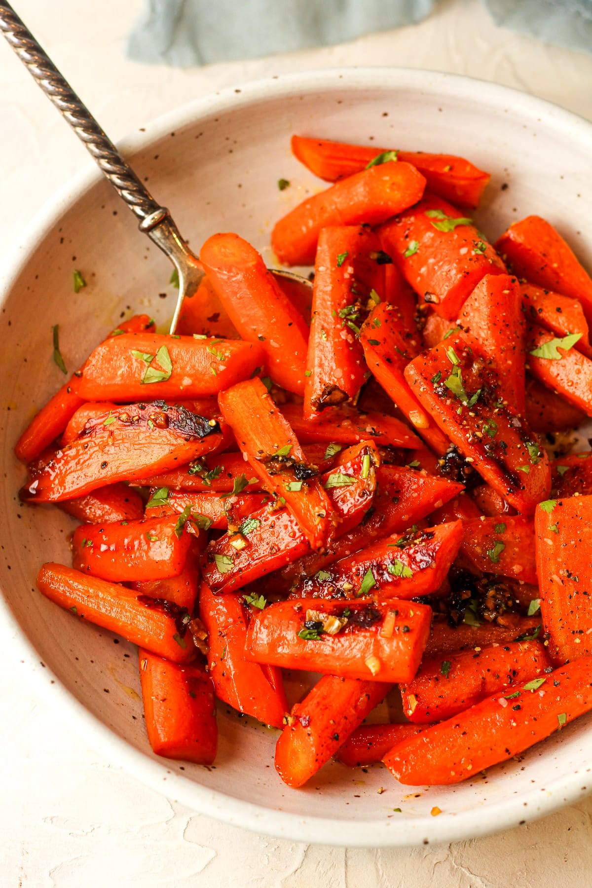 Overhead view of a bowl of brown sugar honey roasted carrots.