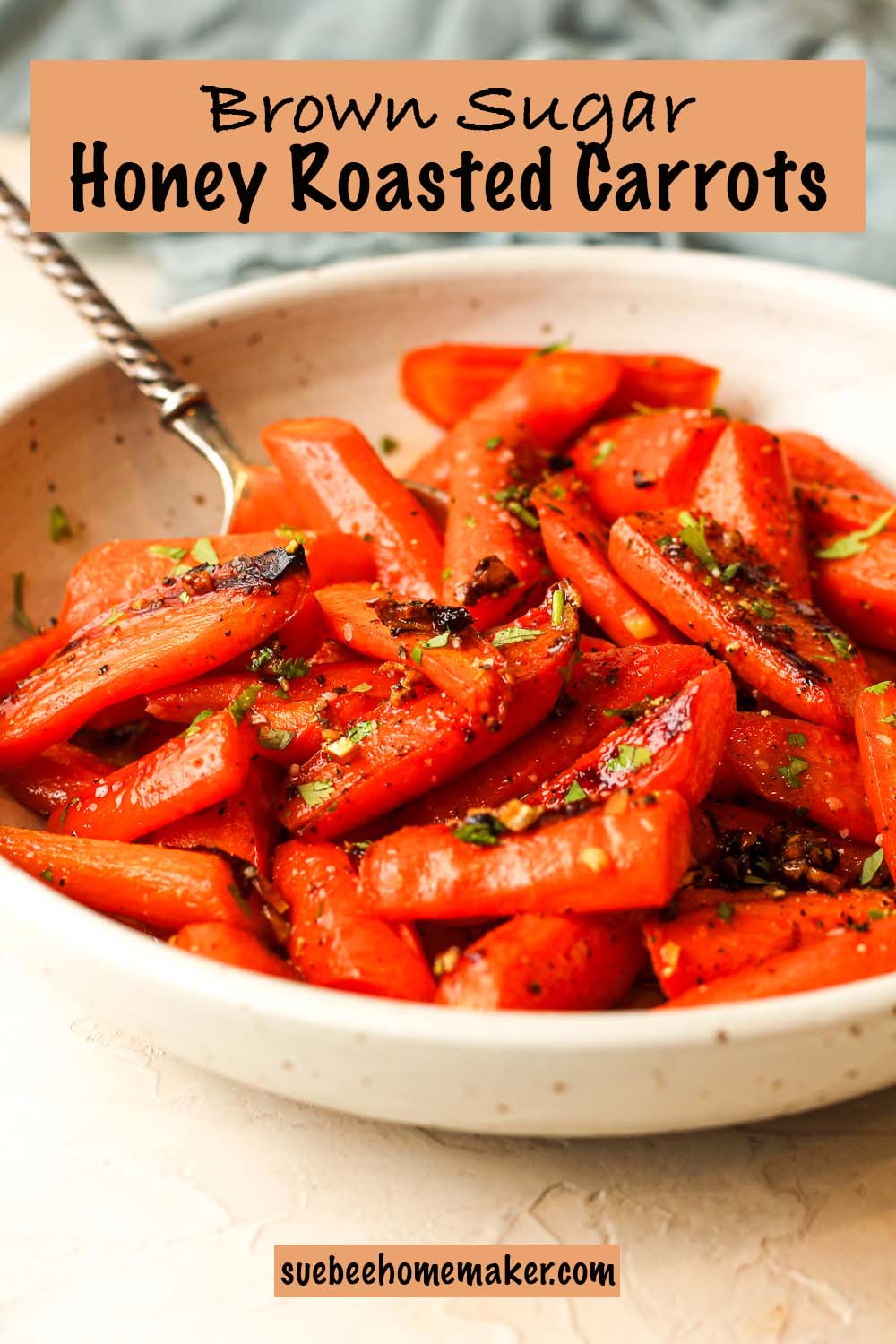 Side view of a bowl of brown sugar honey roasted carrots.