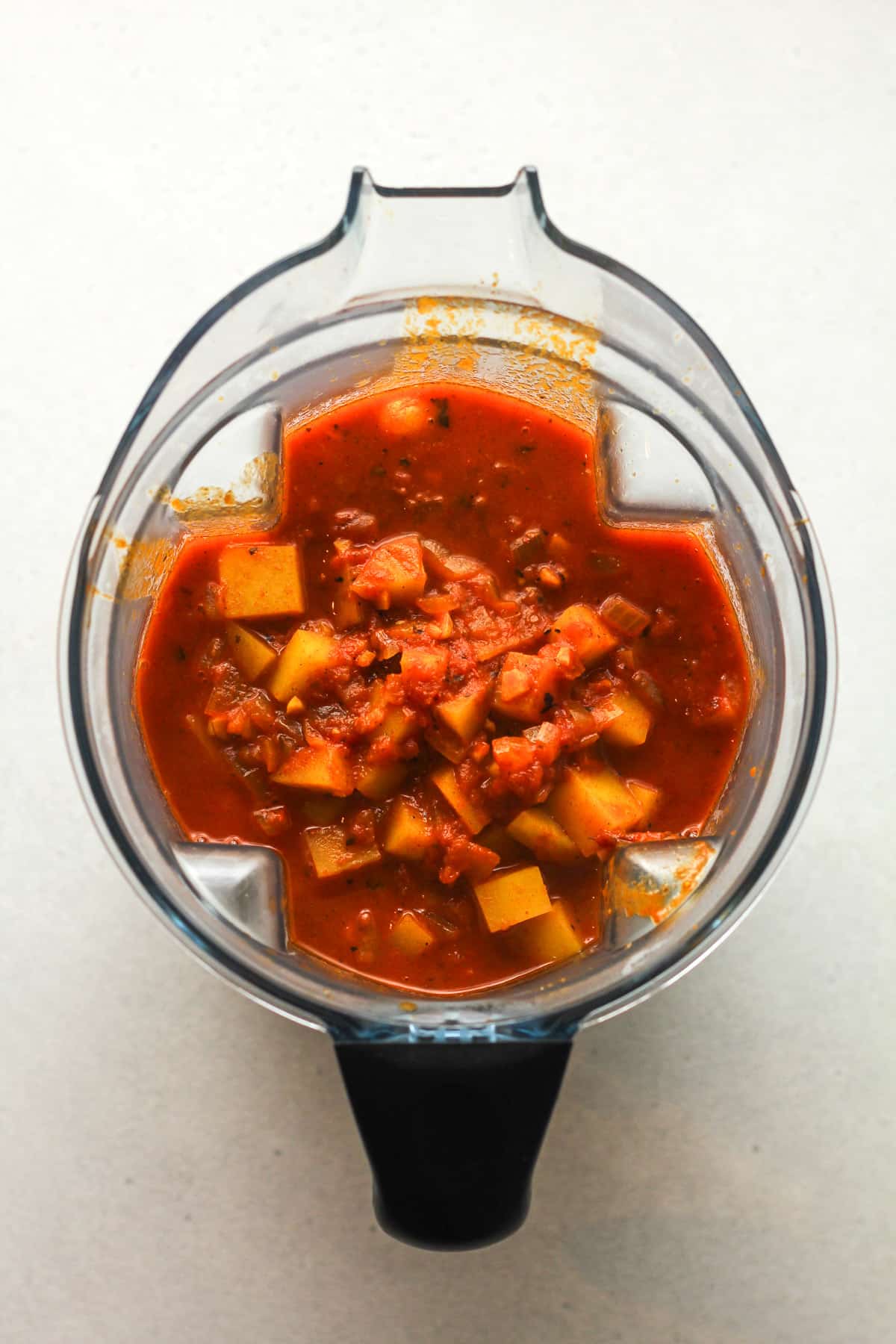 A blender of the soup mixture before blending.