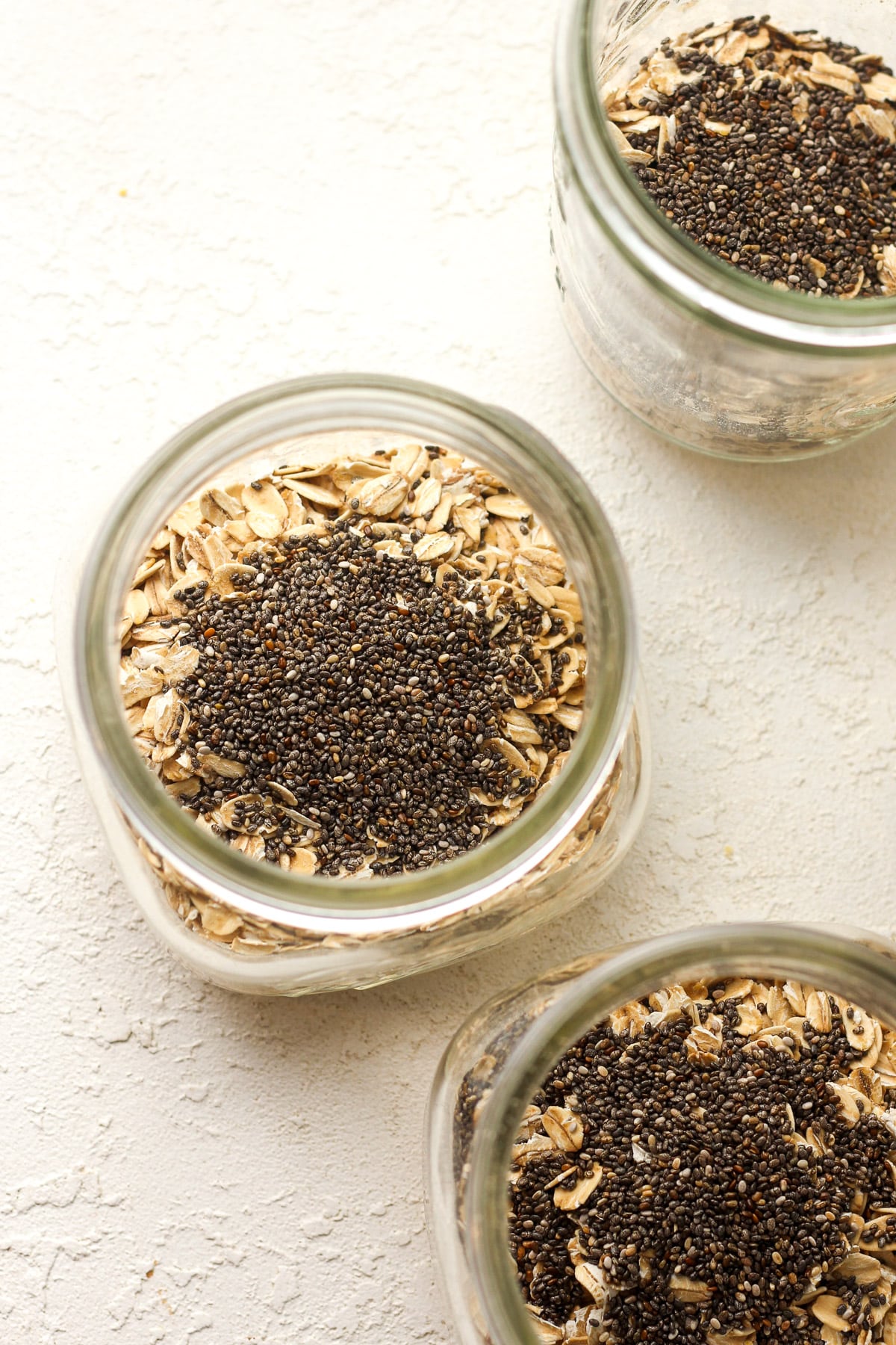 Overhead shot of the jars with the oatmeal plus chia seeds.