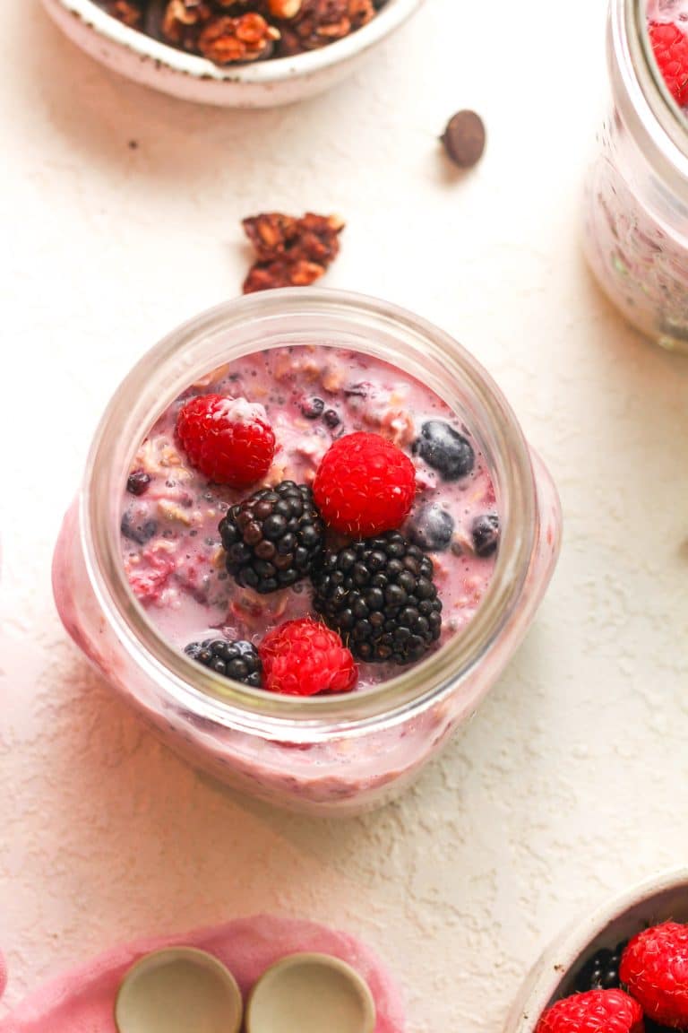 Overhead view of a jar of berry overnight oatmeal.