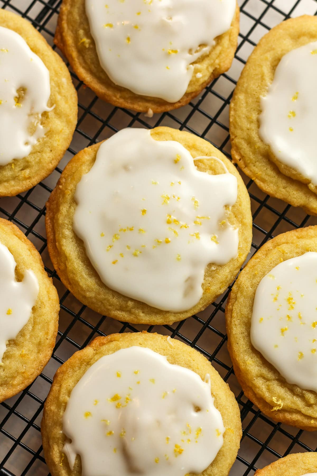 Overhead view of some iced lemon sugar cookies.