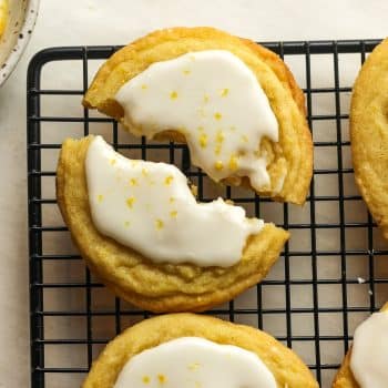 Closeup on a lemon sugar cookie with a simple glaze on top.