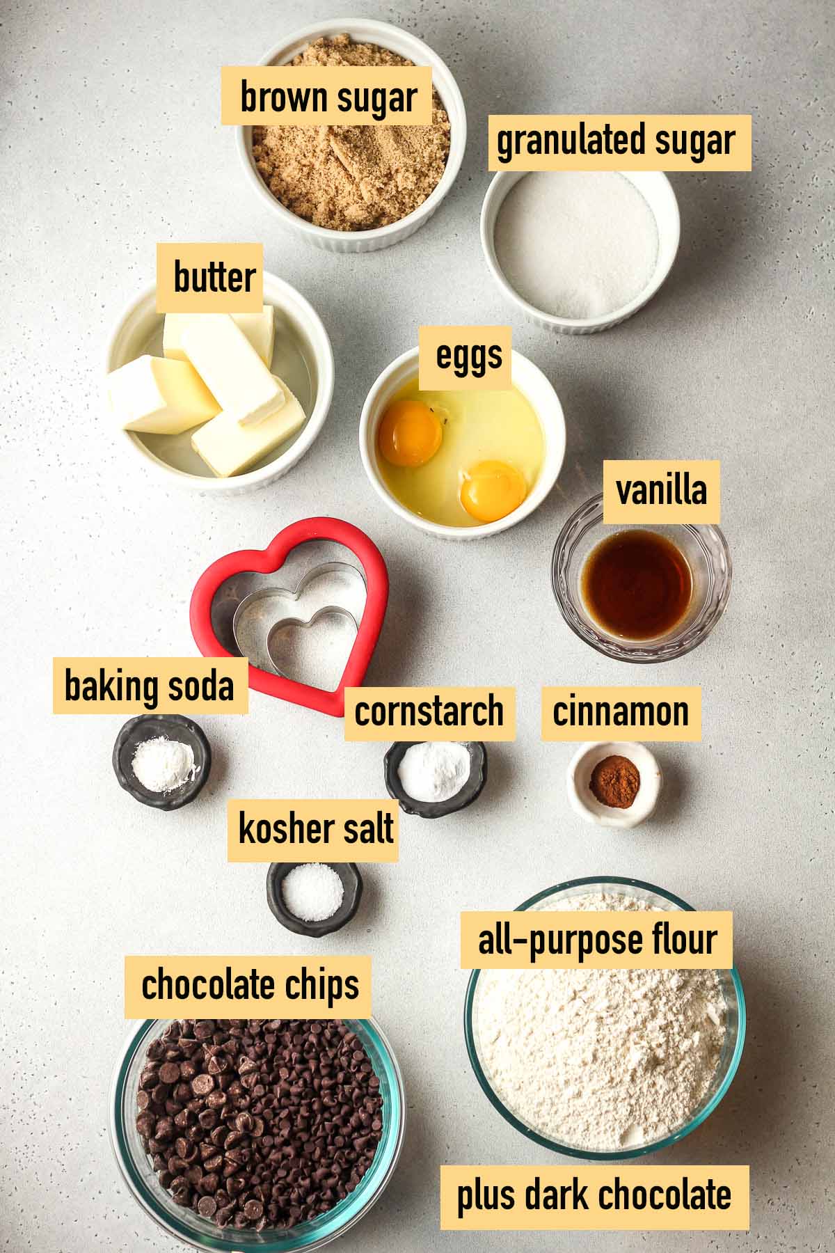 Labeled ingredients for heart-shaped chocolate chip cookies.