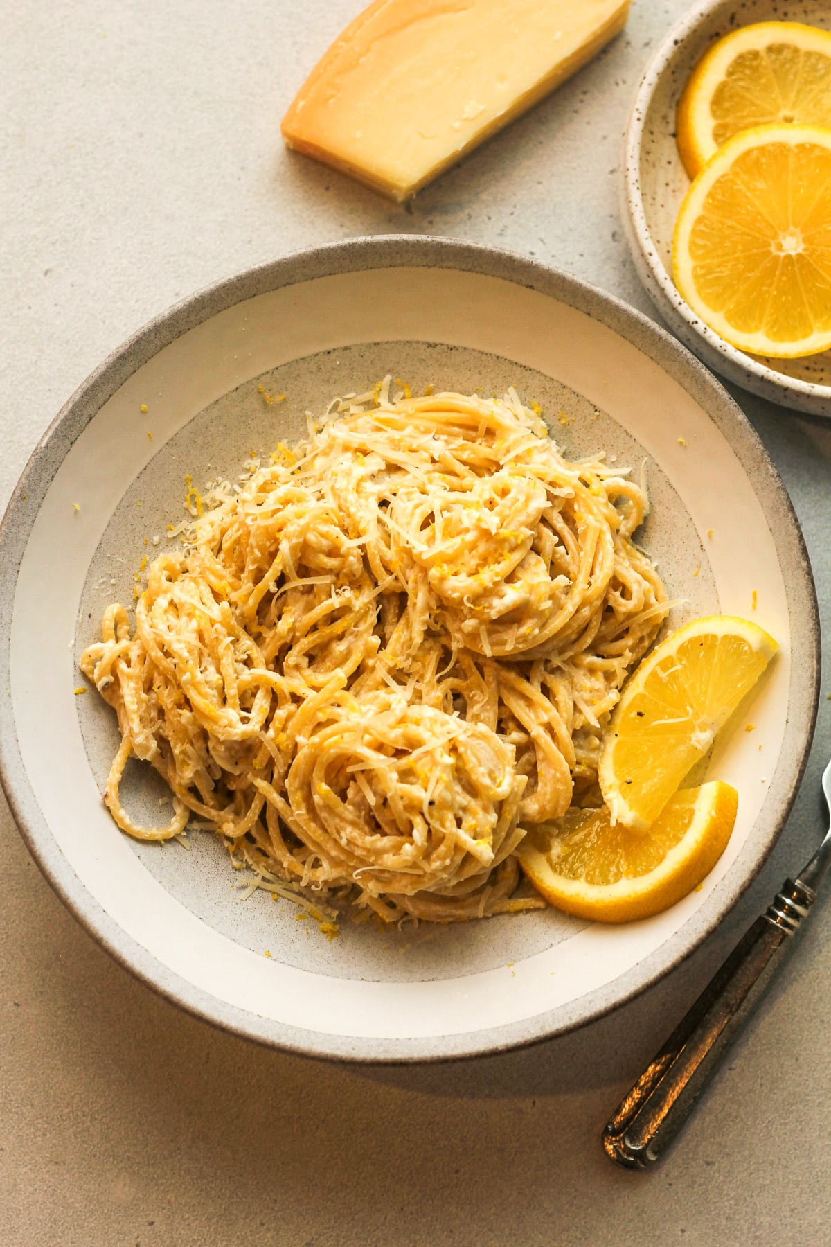 Overhead view of a bowl of lemon ricotta pasta with a fork.