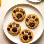 A plate of four paw print cookies.