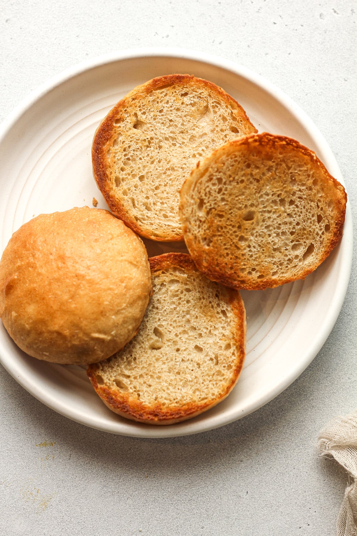 A plate of two toasted buns.