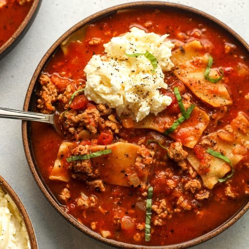 Two bowls of lasagna soup with ground turkey.