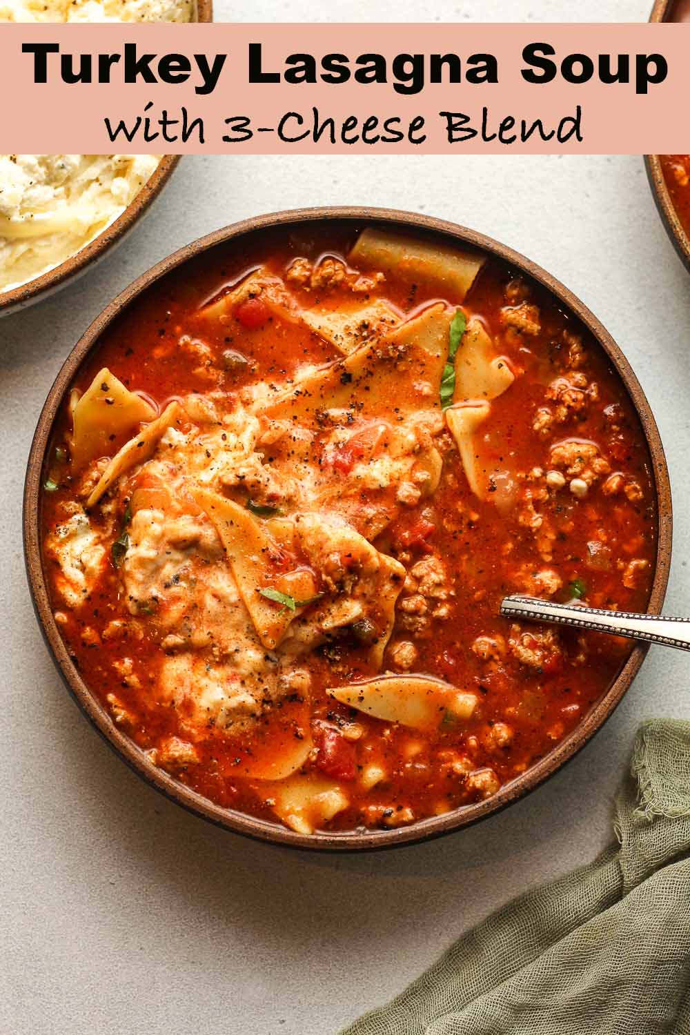 A bowl of turkey lasagna soup with 3-cheese blend.