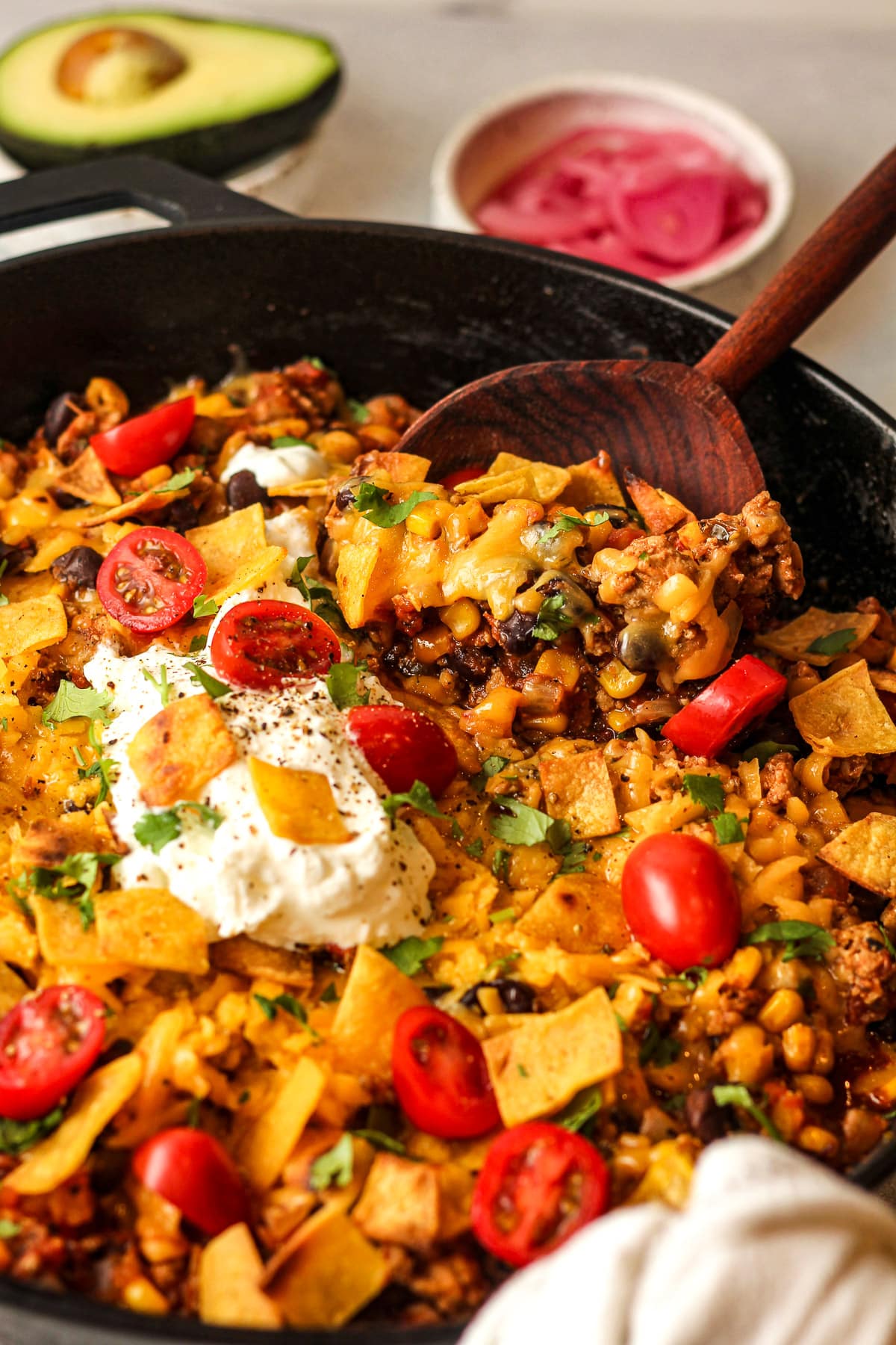 Closeup on the cheesy ground turkey taco skillet showing a spoonful on top.