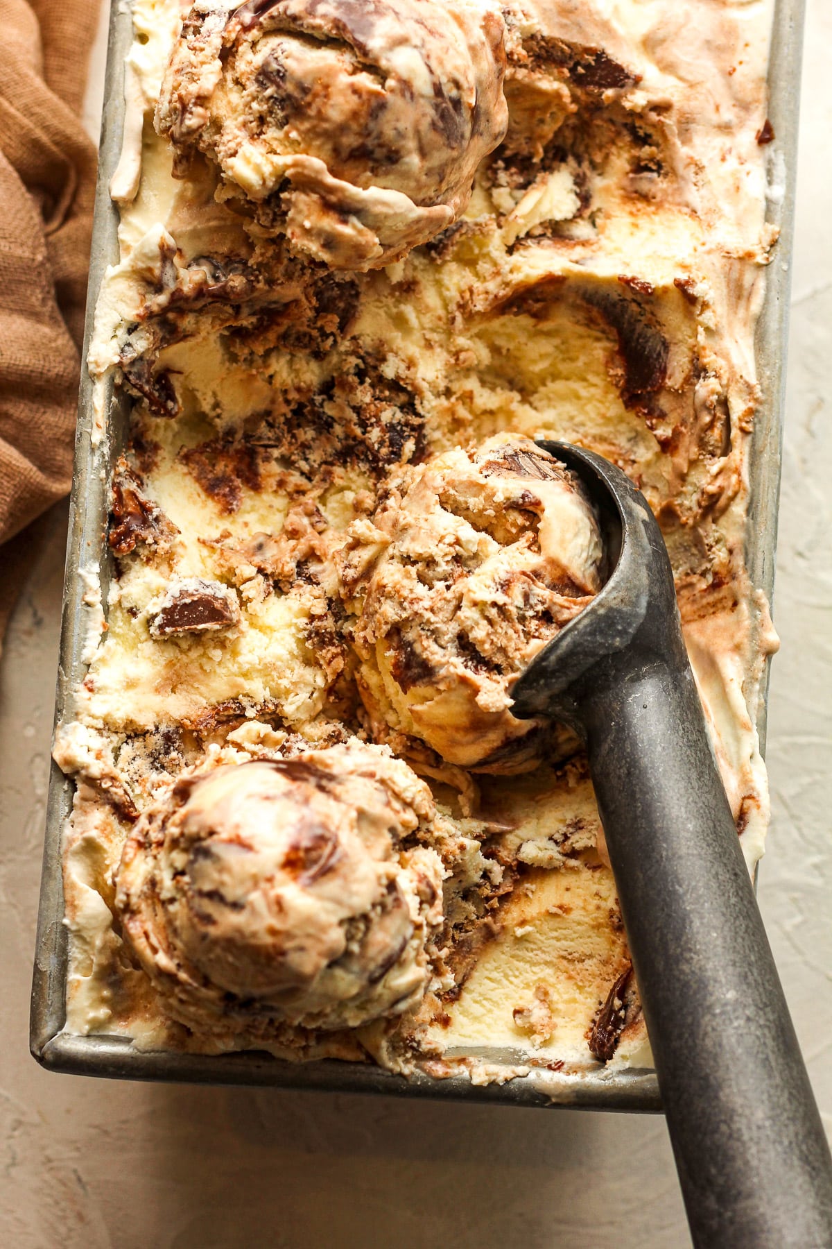 Closeup on a pan of moose tracks ice cream.