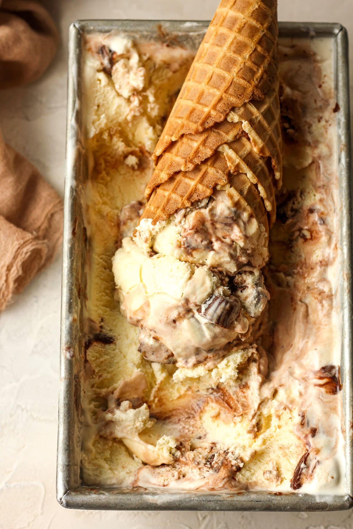 Overhead view of the ice cream with waffle cones filled with ice cream scoops.