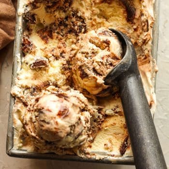 Closeup on some moose tracks ice cream with an ice cream scoop.