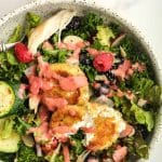 A serving of fried goat cheese salad with strawberry dressing.