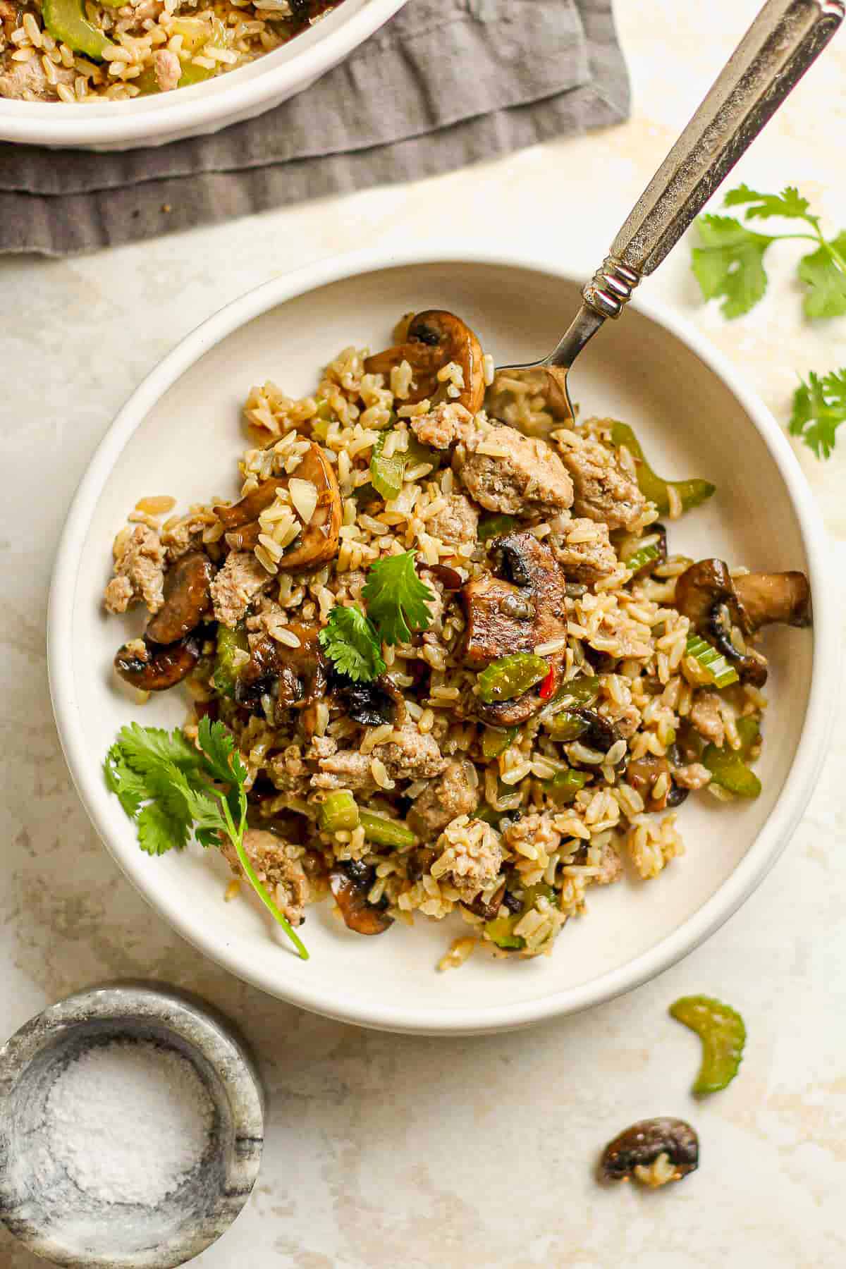 Overhead view of a serving of rice dressing with turkey sausage.