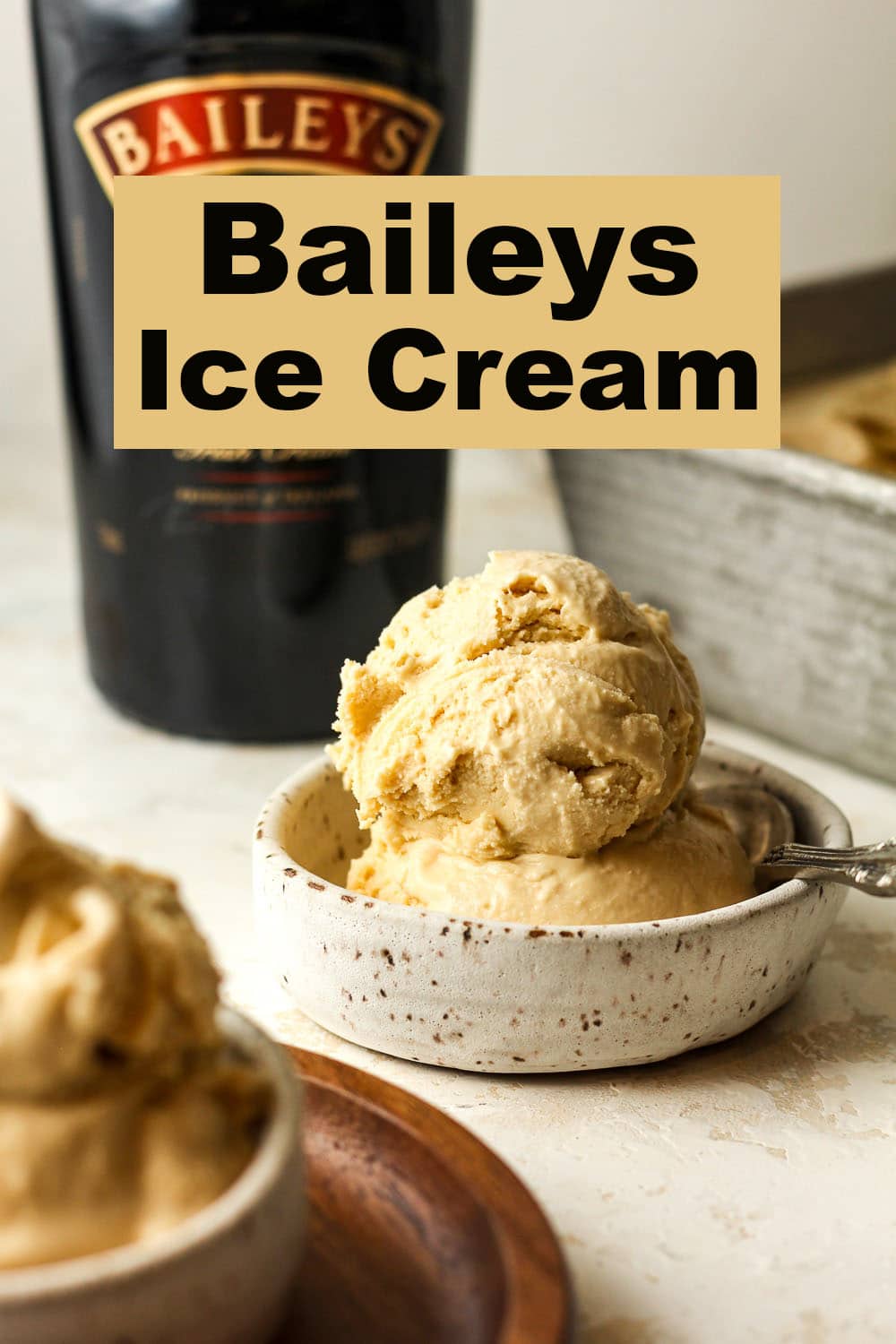 Side view of a double scoop of Baileys ice cream in a small bowl.