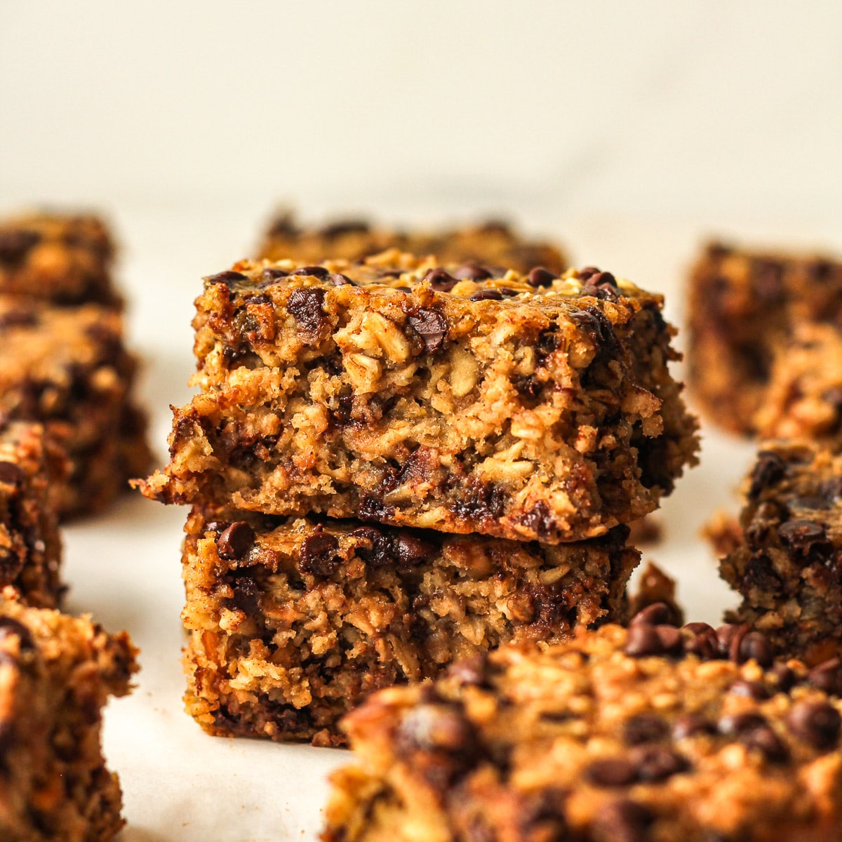 Side view of two stacked banana oat bars.