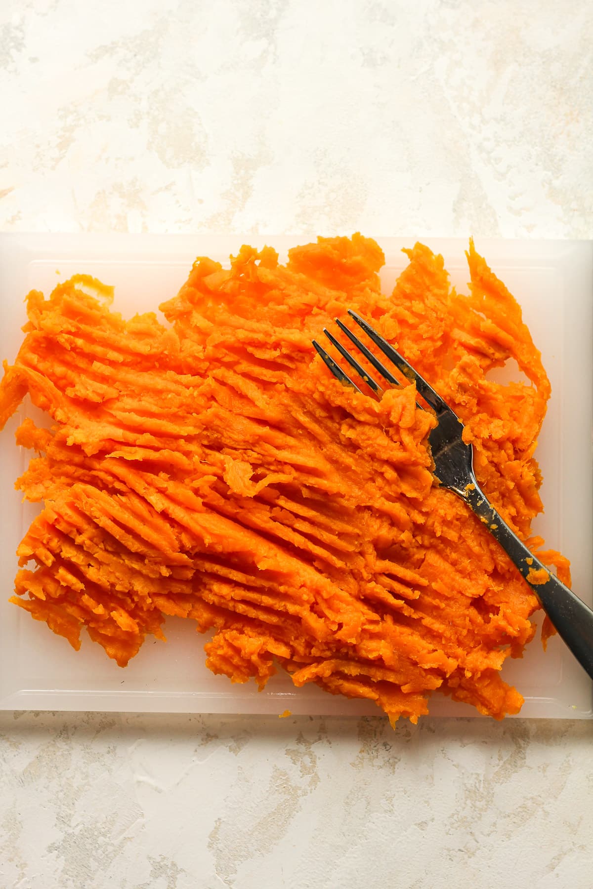 A board of mashed sweet potato.