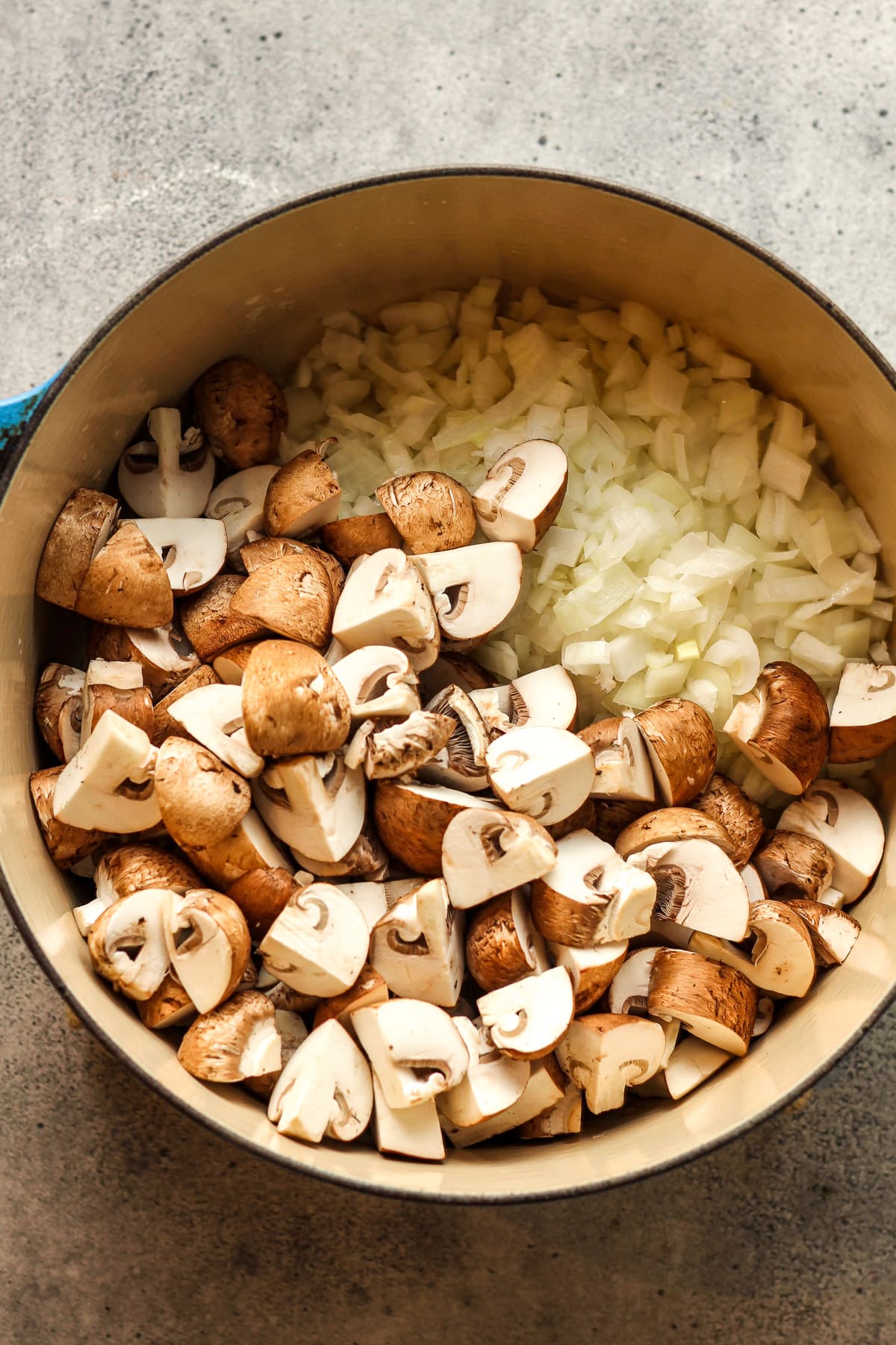 The po tof chopped mushrooms and onions.
