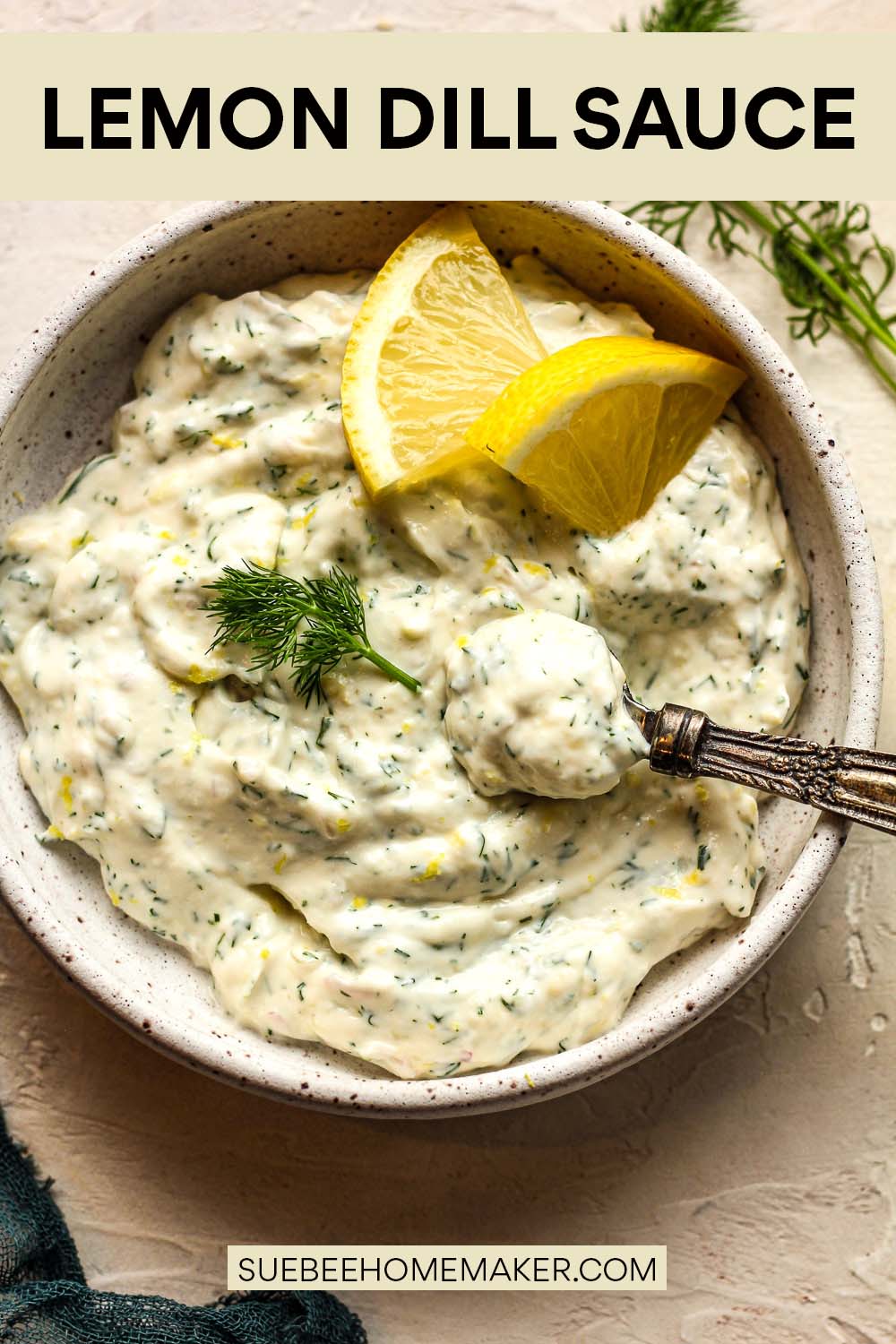 A bowl of lemon dill sauce with a spoonful on top.