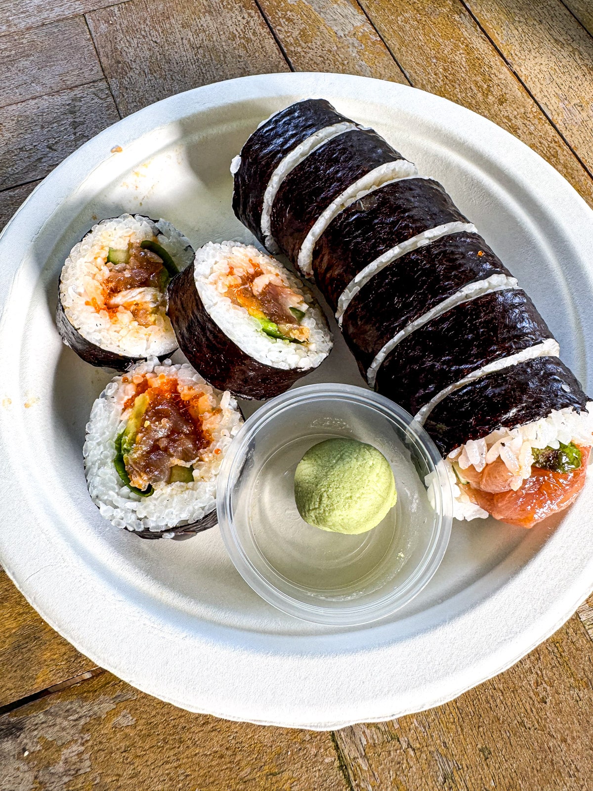 A plate of spicy sushi with wasabi.