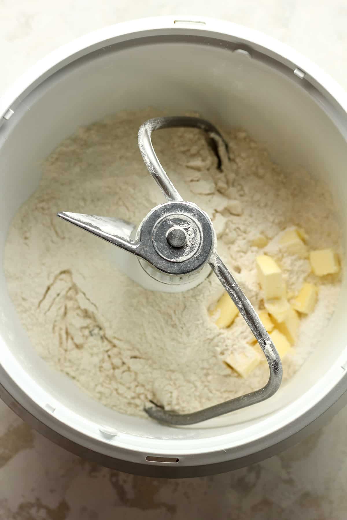 A Bosch mixer with the flour and butter.