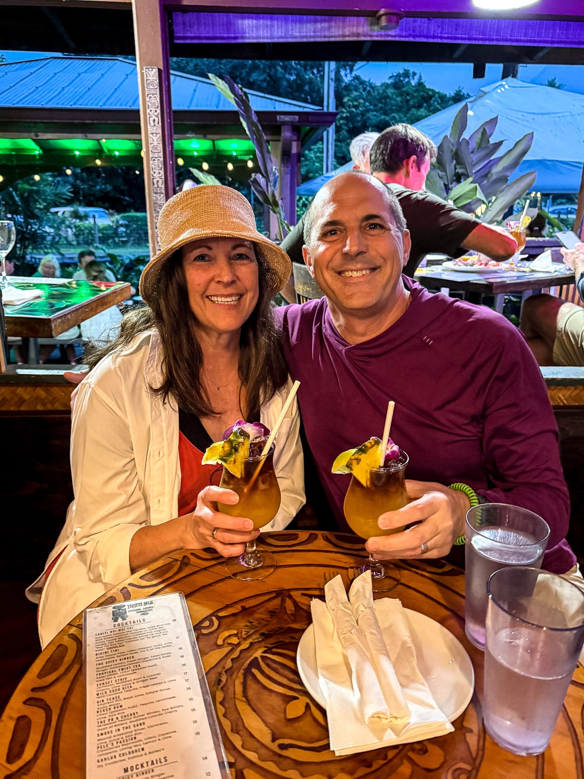 Mike and I holding Mai Tai drinks at Tahini Nui.