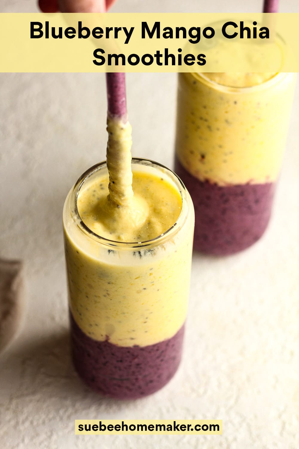 Overhead view of two large blueberry mango chia smoothies, layered.