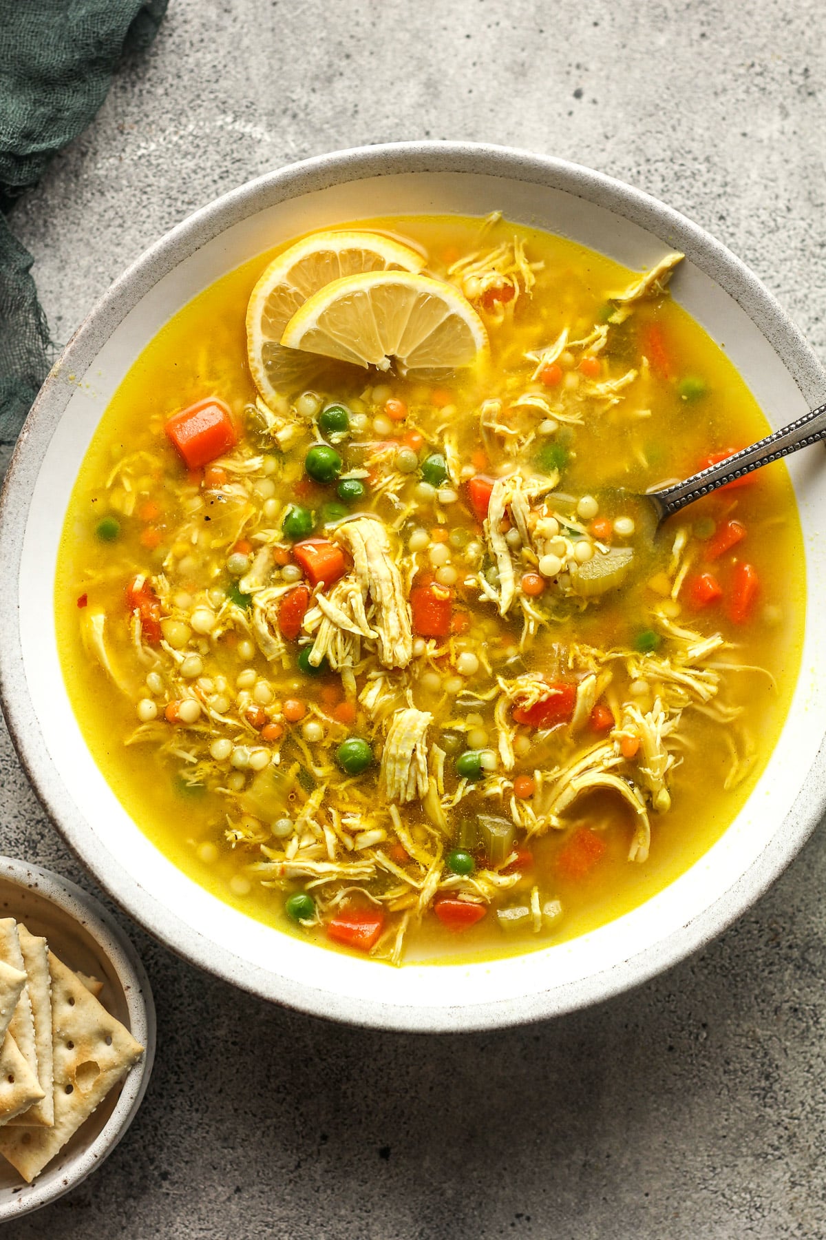 A bowl of healthy chicken and couscous soup.