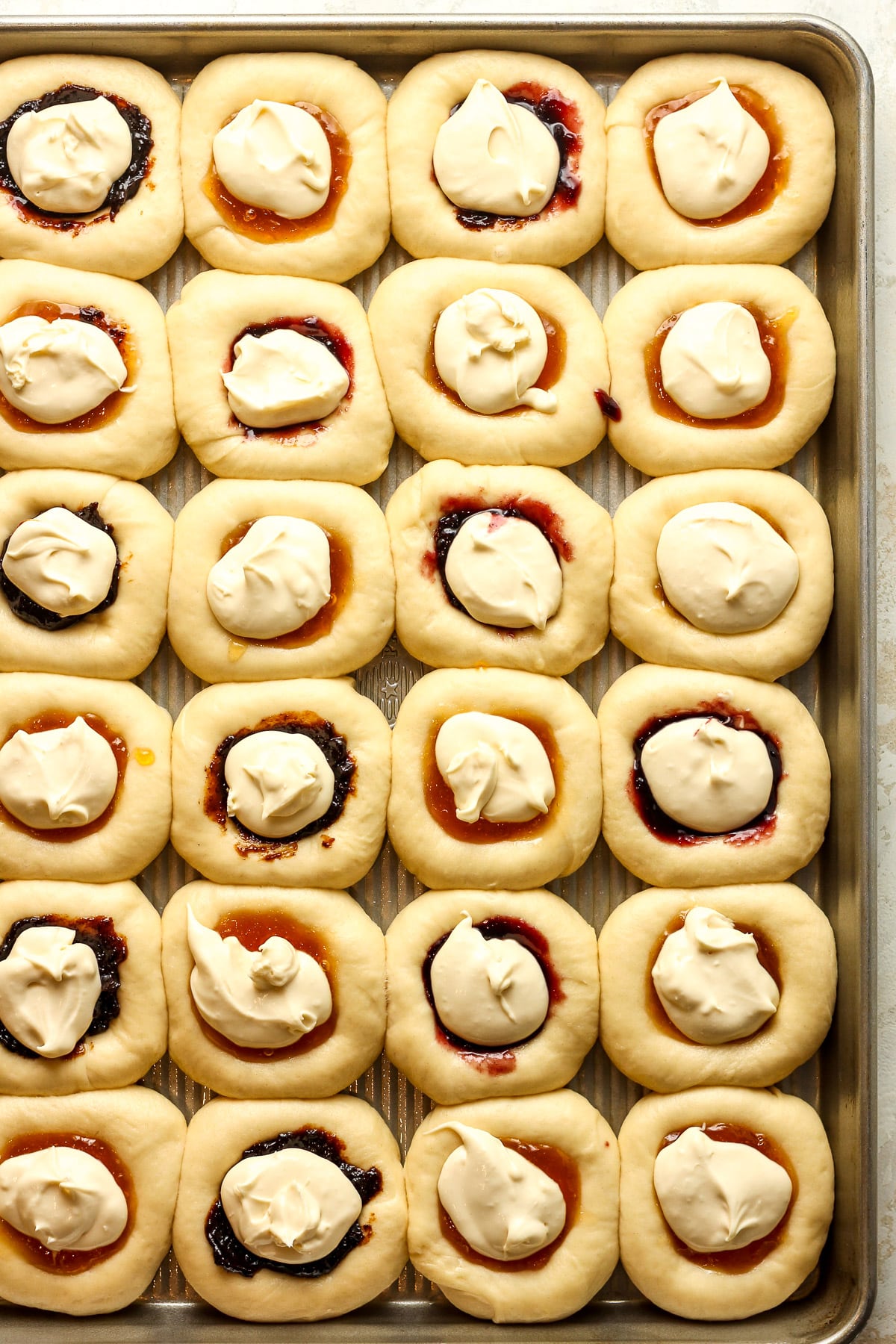 A pan of the prepared kolaches ready to bake.