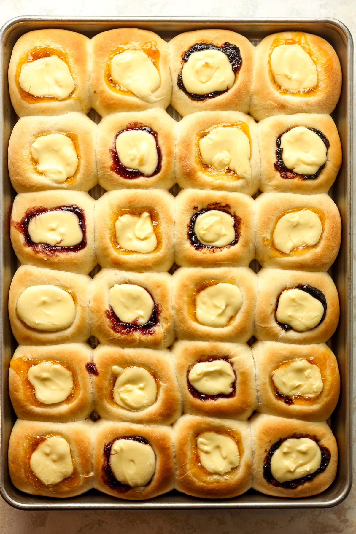 A pan of the baked kolaches before adding the icing drizzle.