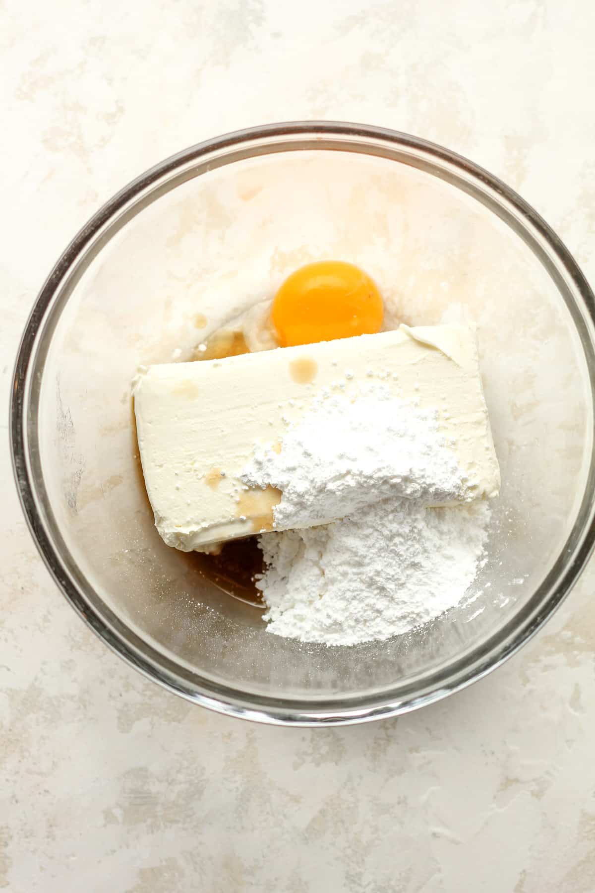 A bowl of the cream cheese ingredients in a bowl.