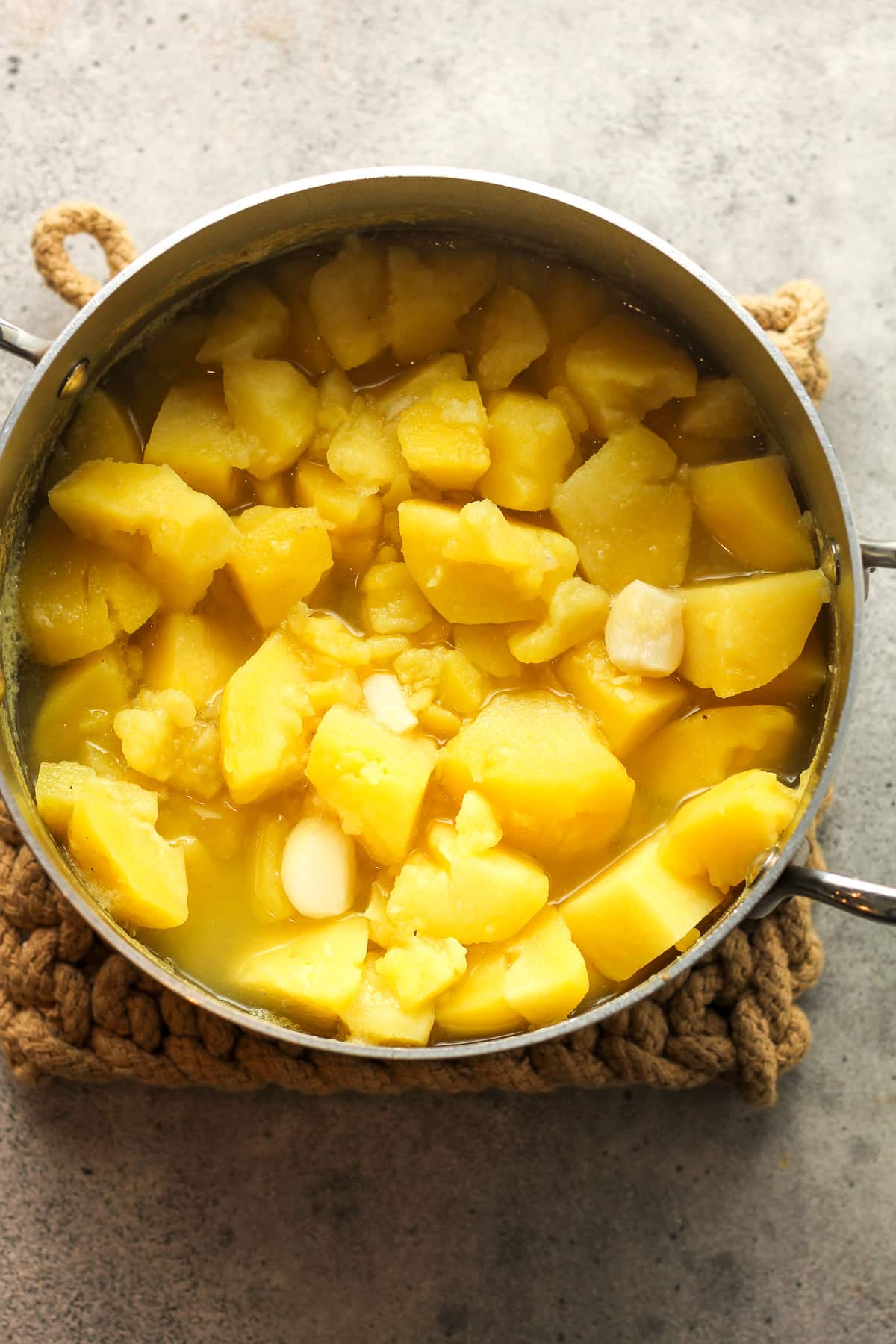 A pot of the cooked yellow potatoes and garlic.