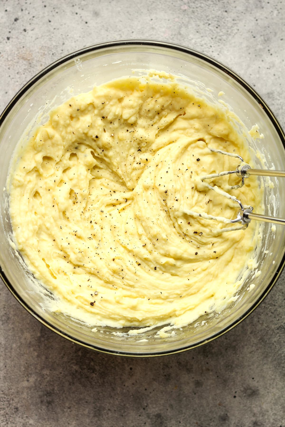 A large bowl of garlic mashed potatoes.